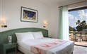 Hotel Cormoran - Pokoj DELUXE, Villasimius, Sardinie