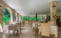Flamingo Resort - Venkovní část restaurace Wild Duck, Pula, Sardinie