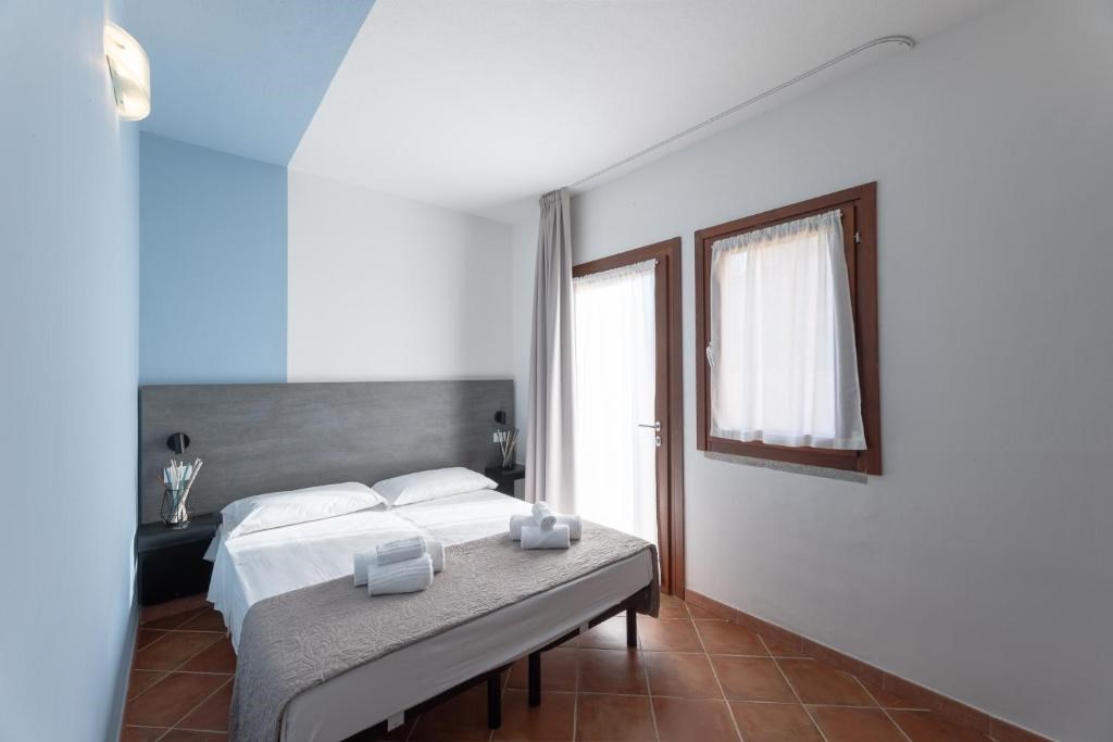 Residence Le Rocce Rosse - Interiér ložnice, Isola Rossa, Sardinie