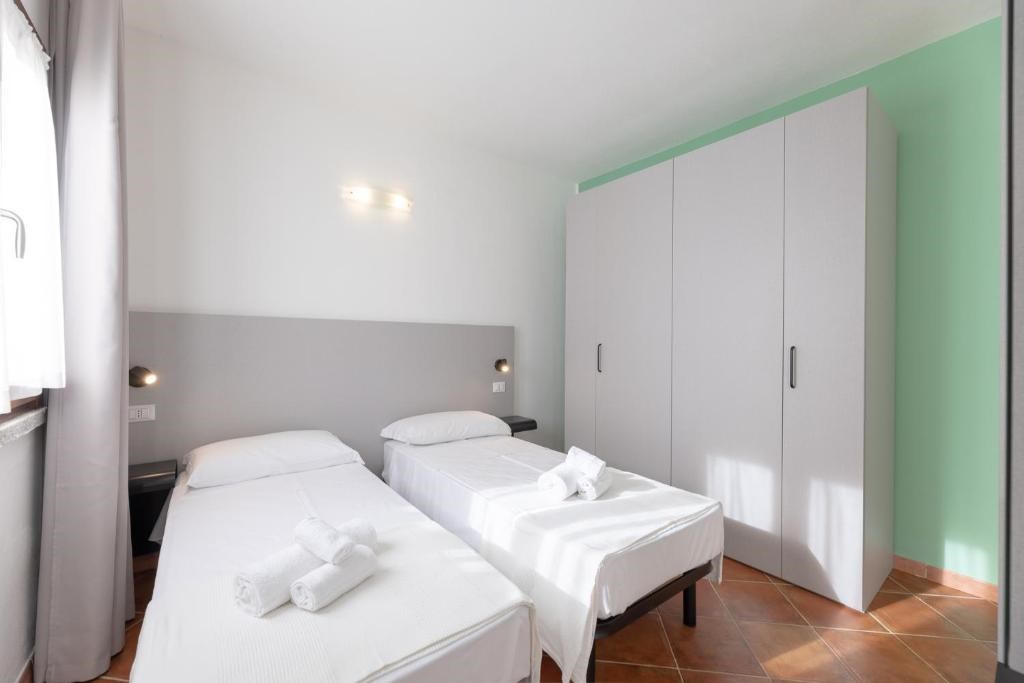 Residence Le Rocce Rosse - Ložnice se dvěma lůžky, TRILO, typologie na vyžádání, Isola Rossa, Sardinie